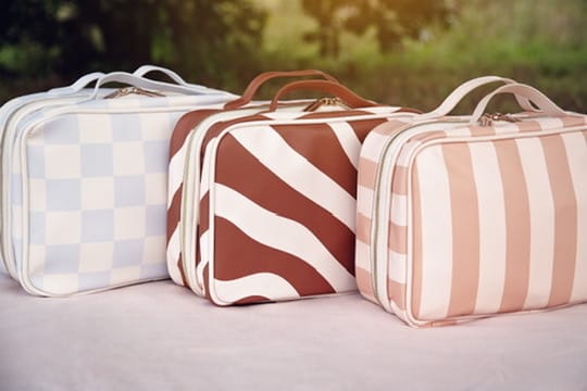 Lifepac Ouchie Kit with first aid supplies in colorful bags for treating minor injuries and scrapes.